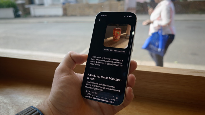 An iPhone showing Siri AI on iOS 27 identifying a soft drink.