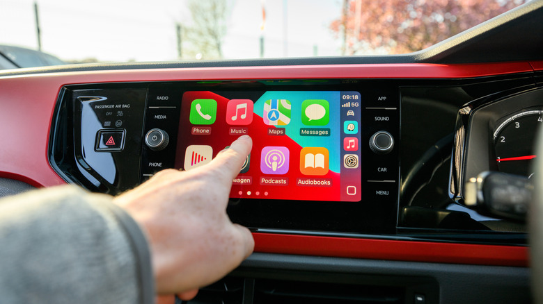 The CarPlay home screen on a car's dashboard.