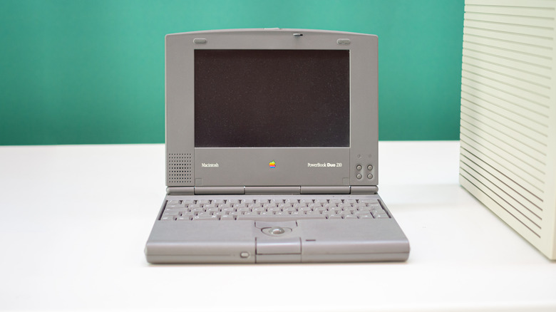An old Apple PowerBook Duo Macintosh subcomputer on display in a museum.