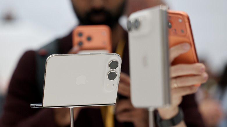 Two white/silver iPhone Duos sitting side by side.