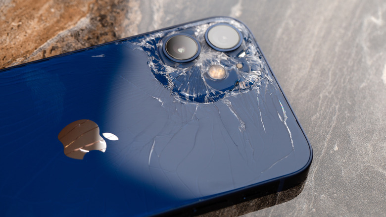 An iPhone with shattered back glass.