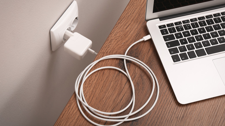 A charger plugged into laptop.