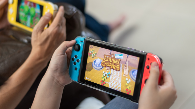 People playing Animal Crossing on Switch in handheld mode