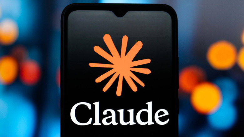 Anthropic's Claude AI logo is shown on a smartphone display against a blue blurred background with orange and red lights
