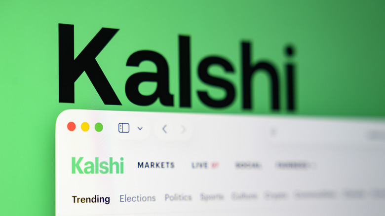 The Kalshi website in front of the company's logo.