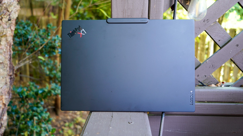 The ThinkPad X1 Carbon Gen 14 on a deck.