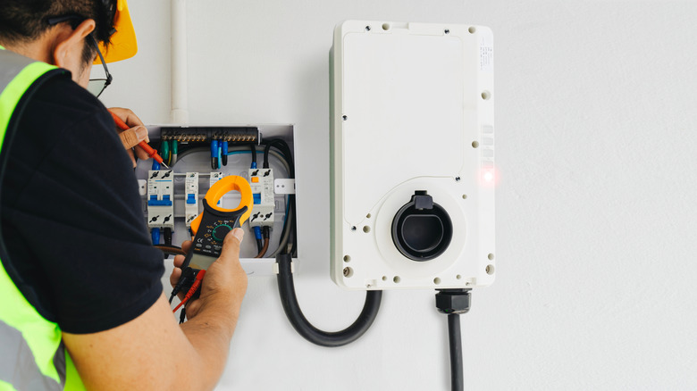Electrician installing an EV charger