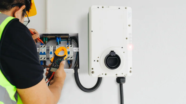 Electrician installing an EV charger