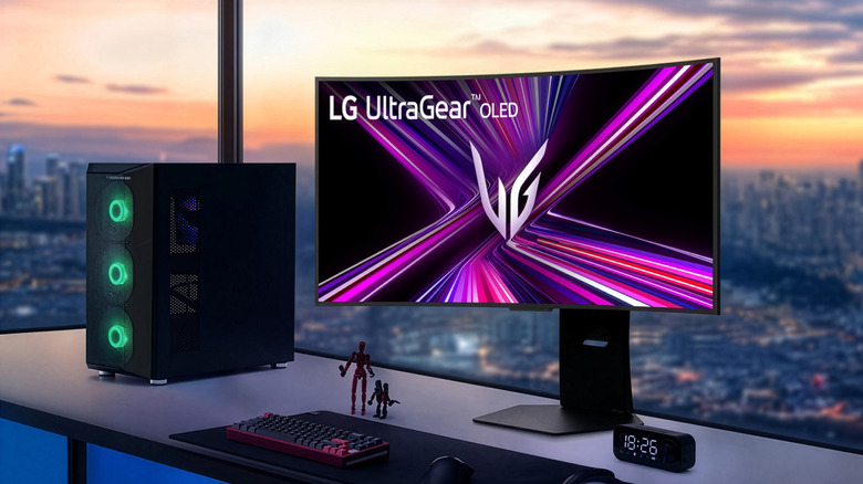 LG curved UltraGear gaming monitor shown in highrise building with view of city and sunset behind