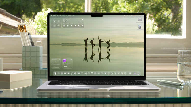 The Liquid Glass interface on a MacBook