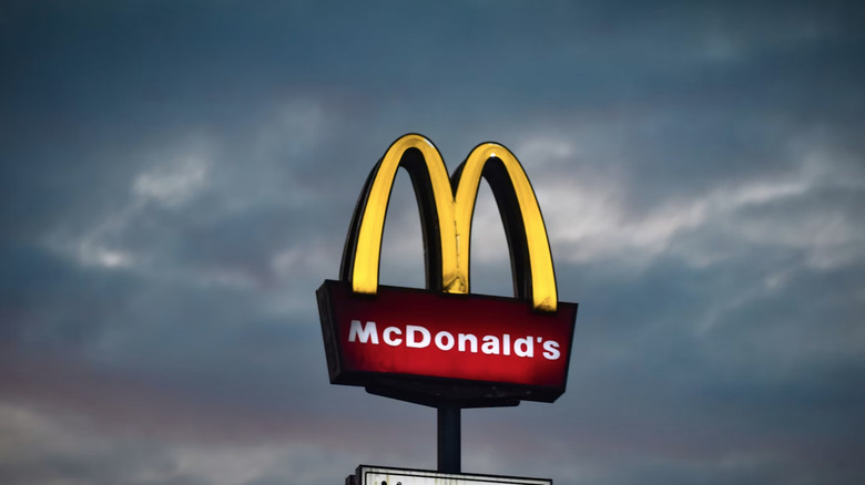 A McDonald's sign in a cloudy area.