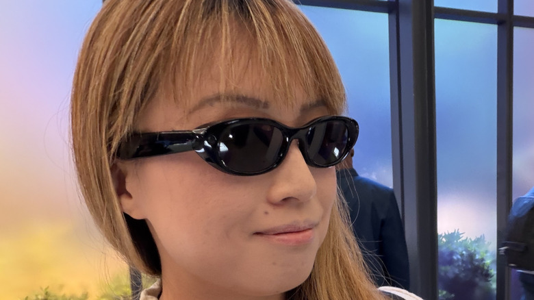 A person wearing the Meta Starfire AI glasses