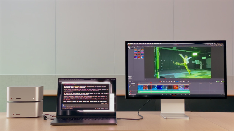 Two Mac Studios connected to a MacBook Pro and a monitor.