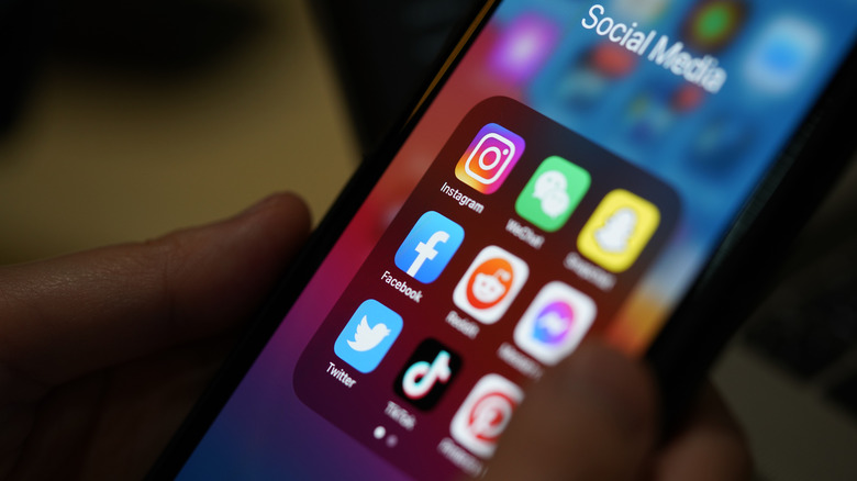 A hand holding a phone.