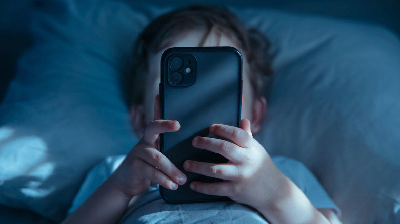 Child using a phone.