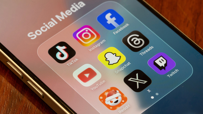 Social media icons on a smartphone.