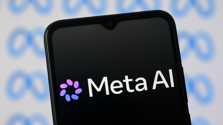 The Meta AI logo on the phone with blurred Meta logos in the background.