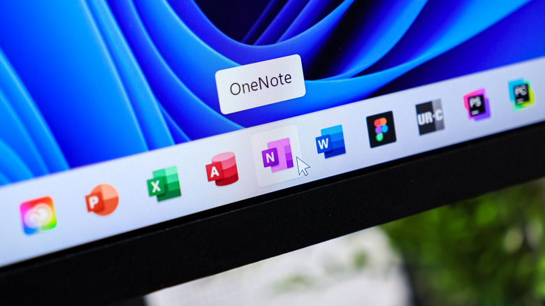 Close-up of the Windows 11 taskbar with various Microsoft Office app icons shown and OneNote highlighted.