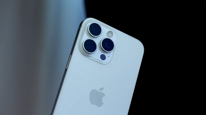 Close-up of the back of a white iPhone 15 Pro Max.