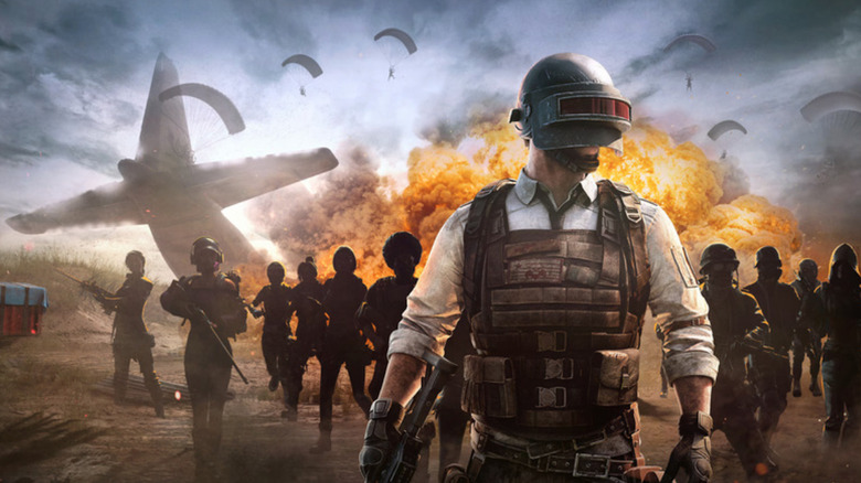 A soldier looks tough while wearing a weird headset.