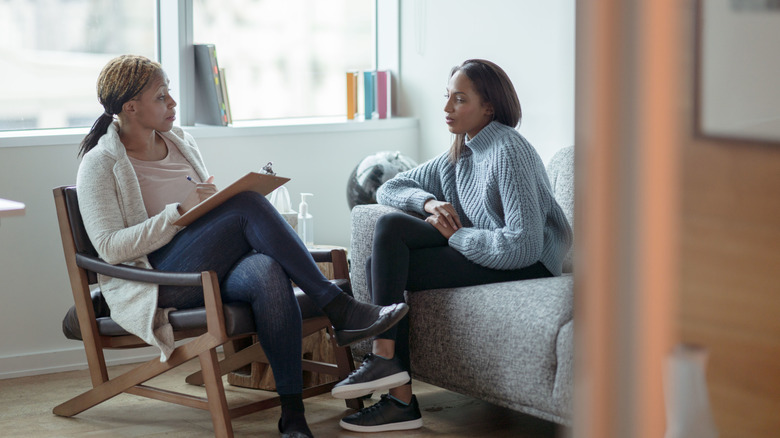 Woman talking with her therapist in an office.