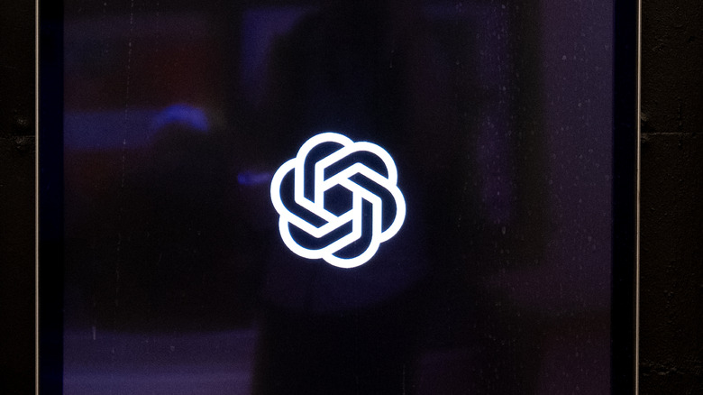 The OpenAI logo on a screen.