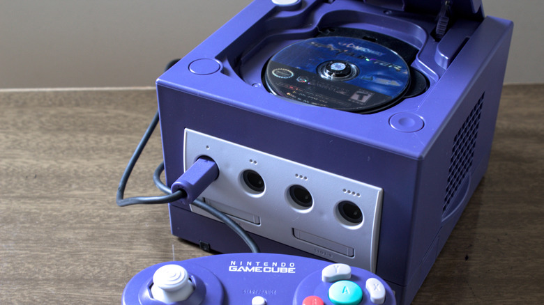 A GameCube with its disc drive open
