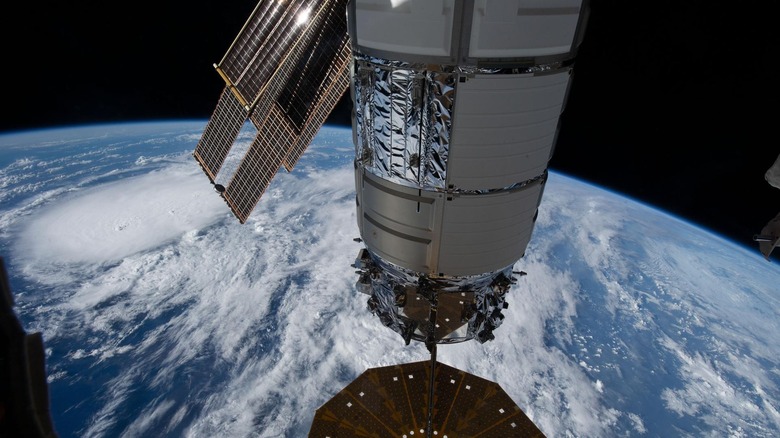 The International Space Station soars over the Earth.