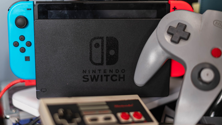 A Nintendo Switch with N64 and NES controllers.