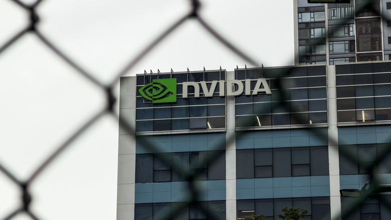 NVIDIA office building shown behind a chain-link fence.
