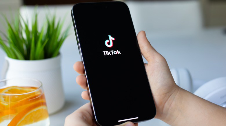 TikTok app loading on an iPhone 15 Pro