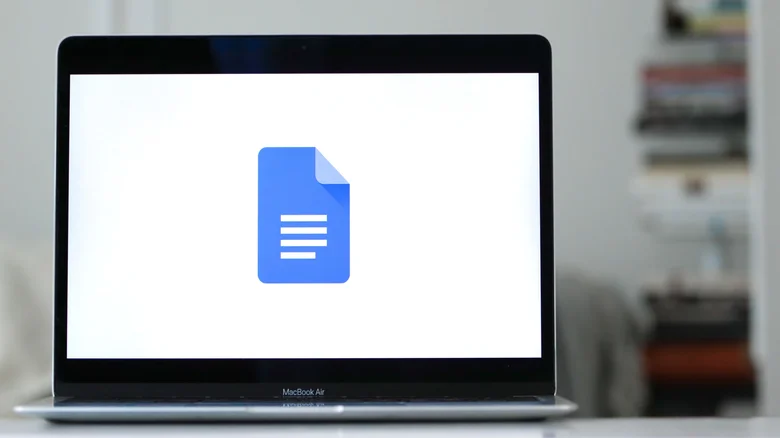 Google Docs logo displayed on a MacBook Air.