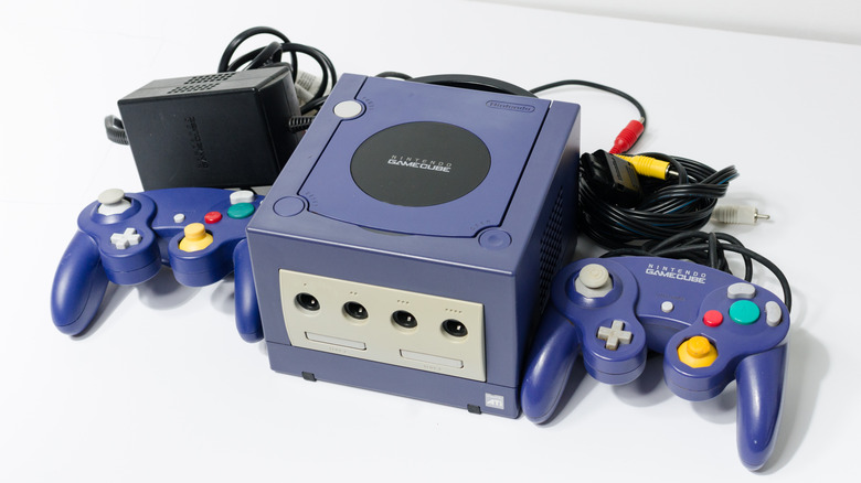 An Indigo GameCube with two controllers, plus the power and A/V cables.