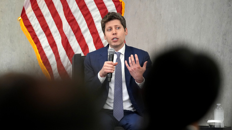 Sam Altman speaking in front of a crowd.