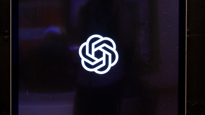 The OpenAI logo on a dark screen.
