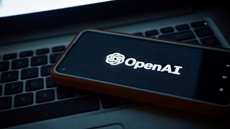 The OpenAI logo on a phone.