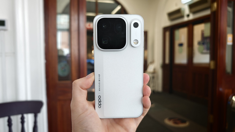 The Oppo Find X10 Pro Max, held in hand.