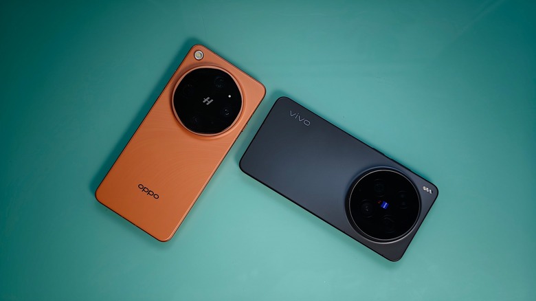 Oppo Find X9 Ultra and Vivo X300 Ultra, face down on a teal surface.
