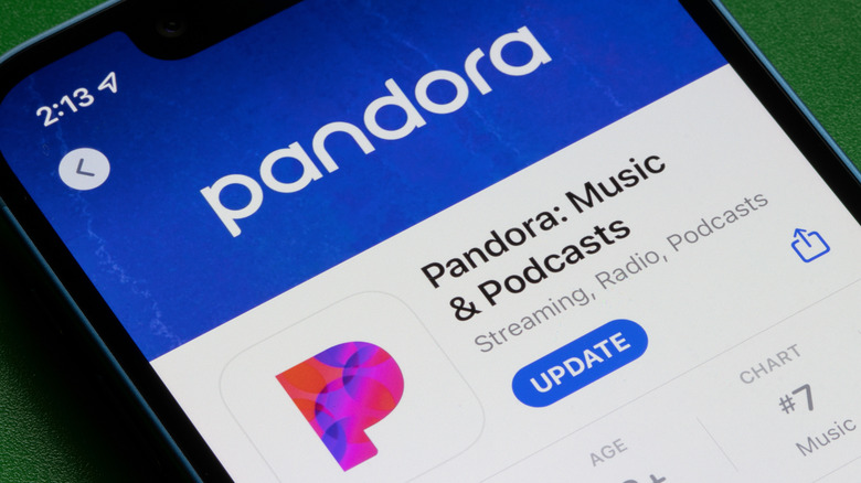 A phone shows the Pandora Music and Podcast app ready to be updated in a user's app store.