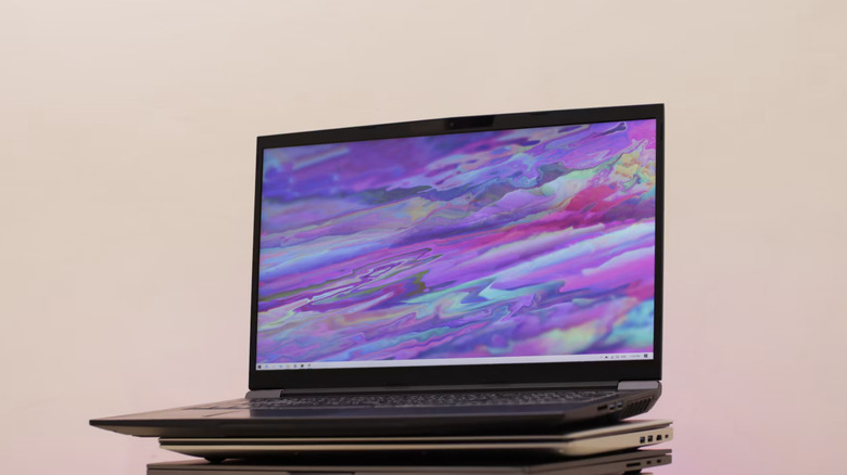 Many laptops stacked.