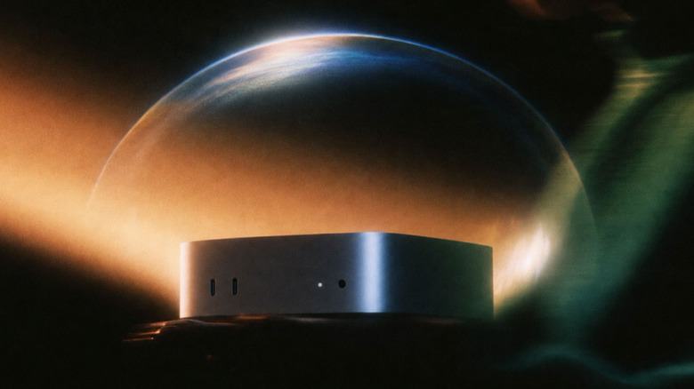 A Mac Studio with a moon-like object behind it.