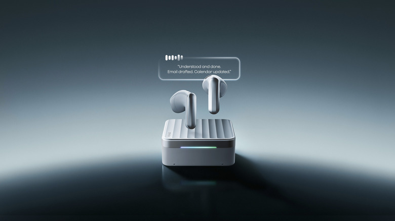 A closeup of the Plaud One earbuds and charging case.