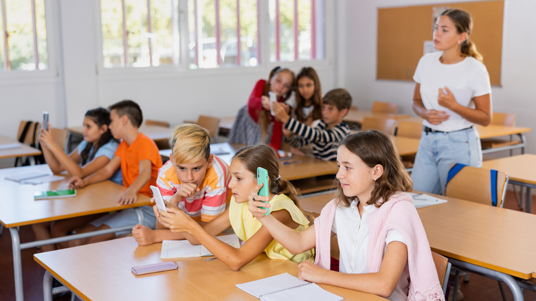 students using phones in the classroom