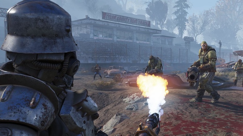 A figure wearing armor and a helmet wields a flamethrower as they face mutated enemies