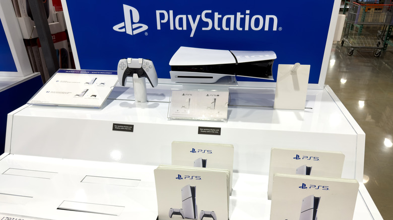 PlayStation 5 Slim disc console white bundle display, including a DualSense wireless controller, at Costco.
