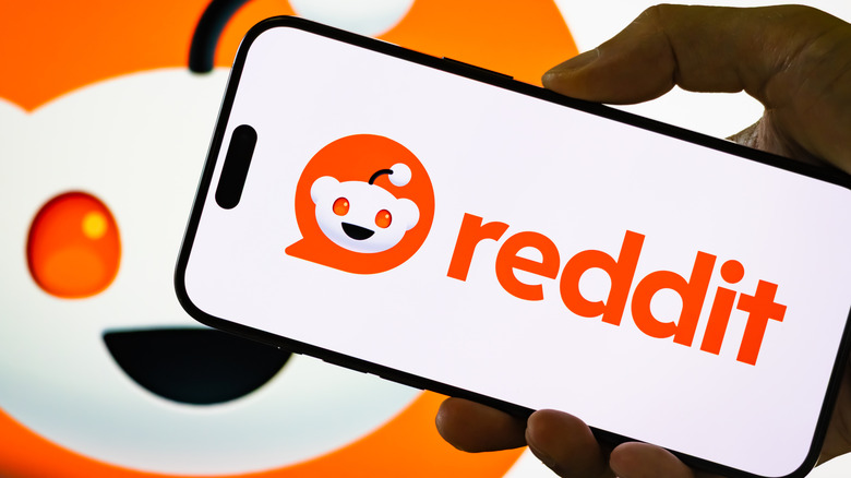 Reddit logo on a phone