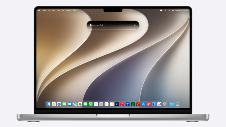 Photo of a MacBook with the Siri prompt open
