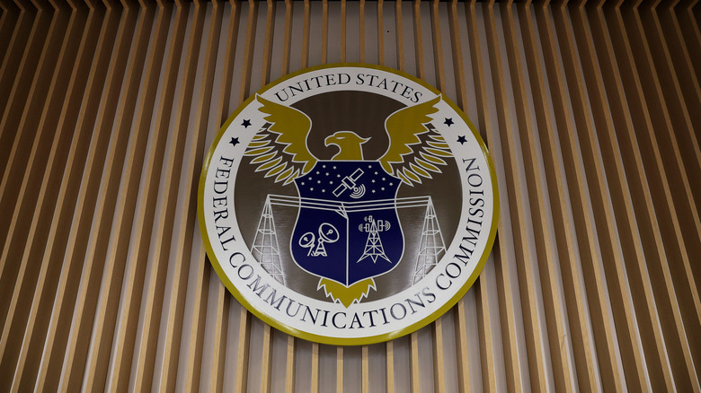 The FCC seal on the wood wall
