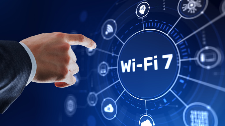 Hand pointing towards a screen where you can see Wi-Fi 7 written in white over blue background