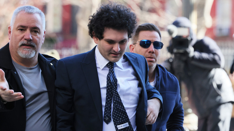 Sam Bankman-Fried is escorted into court.